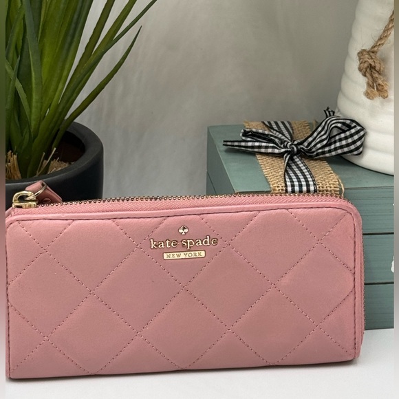 Kate Spade Emerson Place Nisha zip-around wallet in quilted leather and a pink